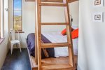 The second bedroom is equipped with a big bunk bed.
